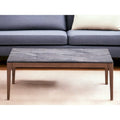 Table basse en pierre grise et noyer massif